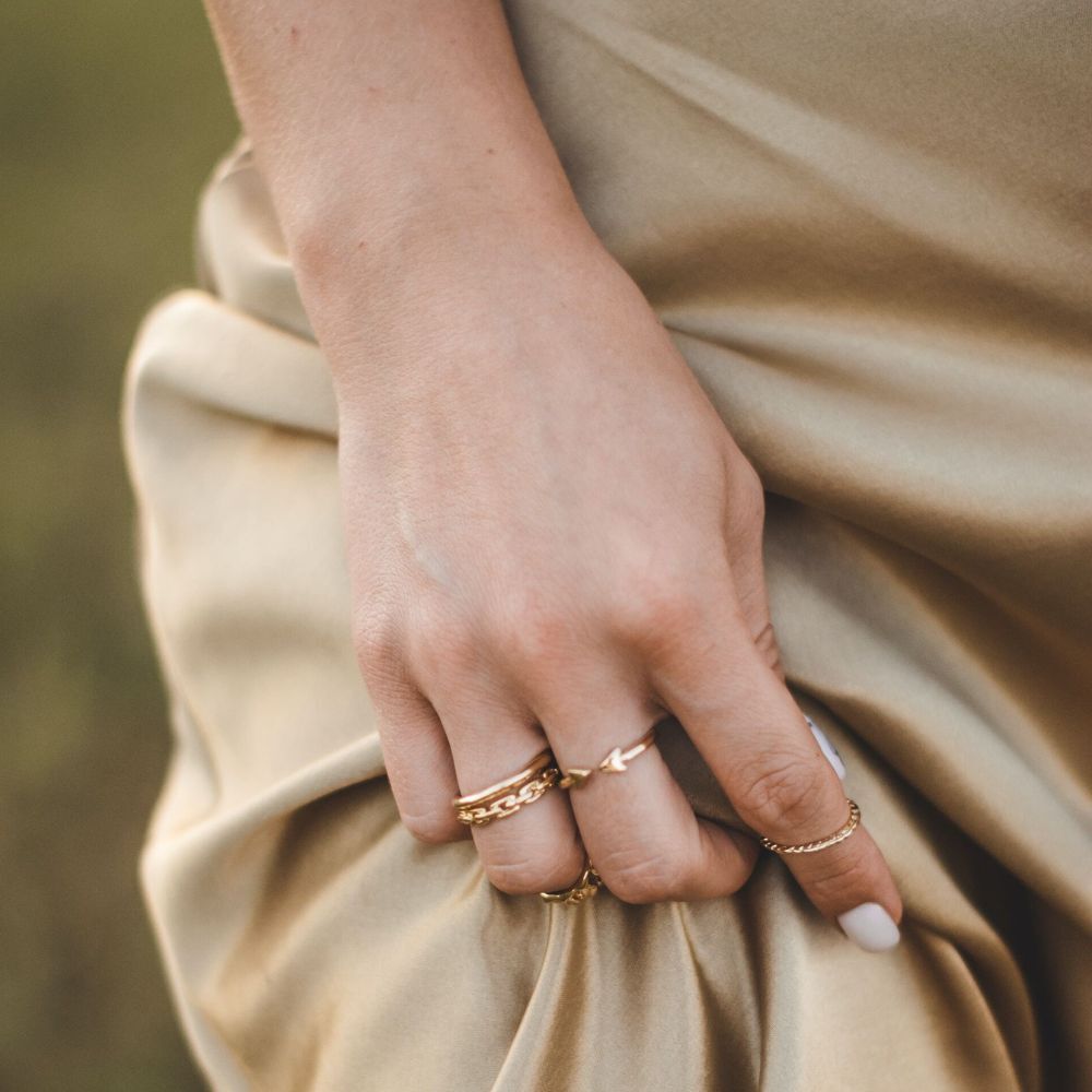 woman's hand shows her jewelry style