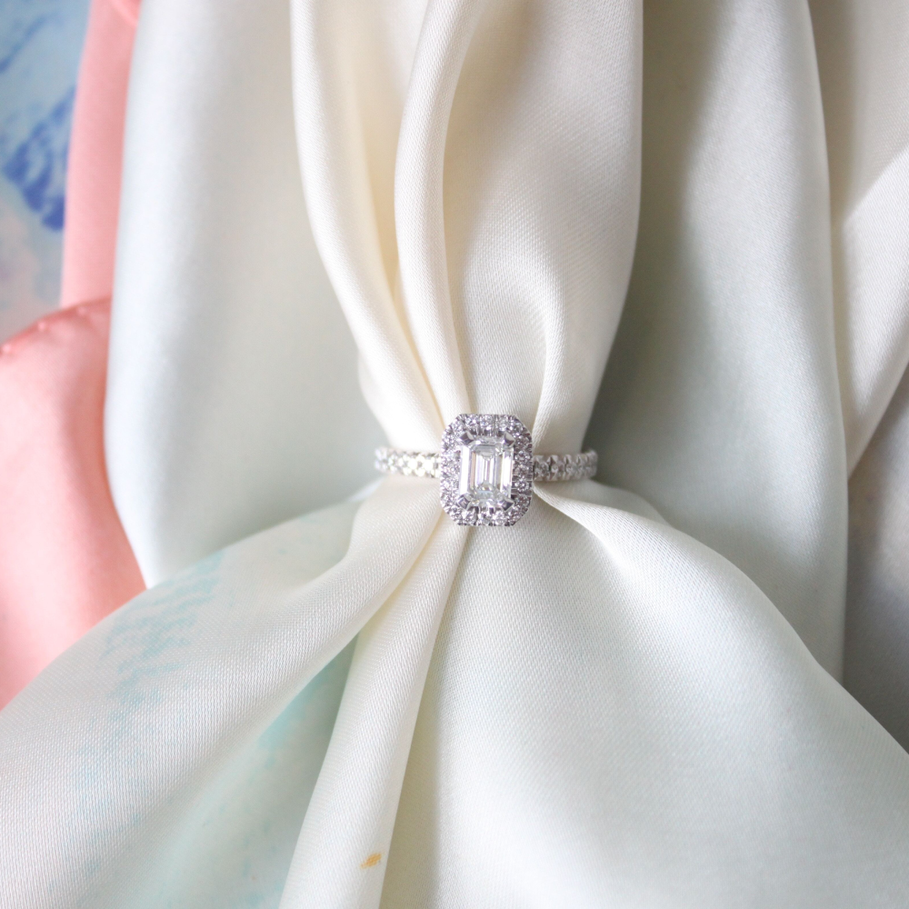 White diamond ring with white fabric going through