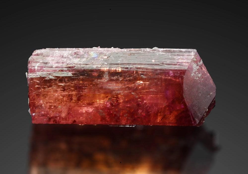 a close-up of a large piece of uncut pink tourmaline